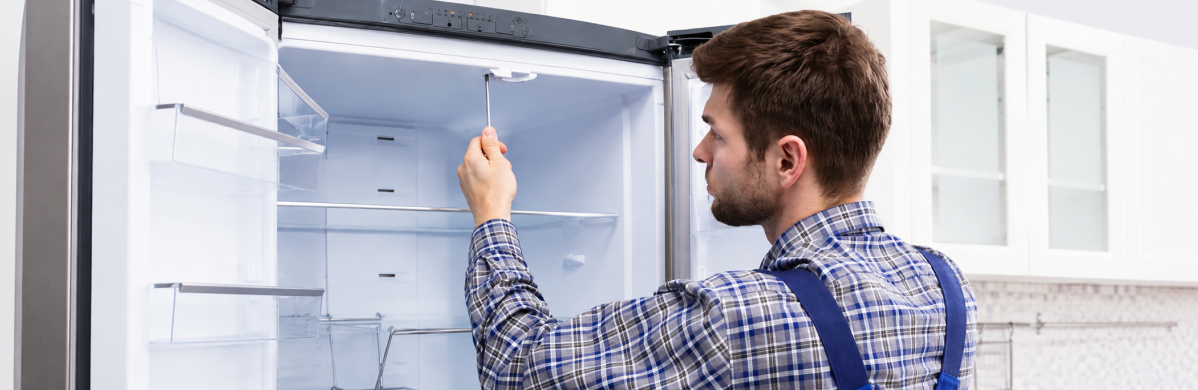 Technician conducting comprehensive component level diagnostic on industrial control panel